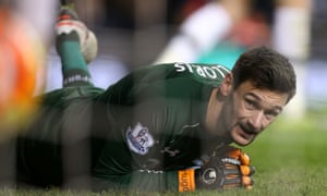 Tottenham goalkeeper Hugo Lloris looks ruefully at the ball in the back of the net, having failed to stop Ayoze Perez from netting a late winner for Newcastle.