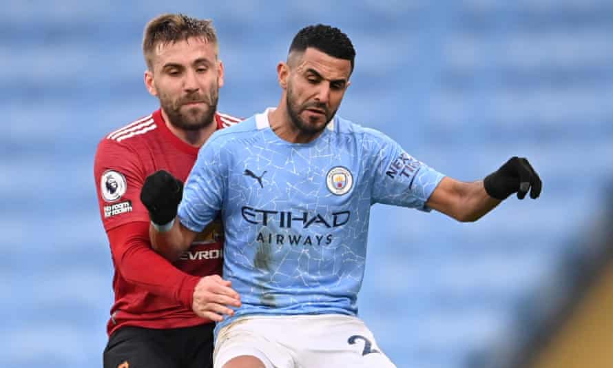 Luke Shaw (left) and Riyad Mahrez do battle.