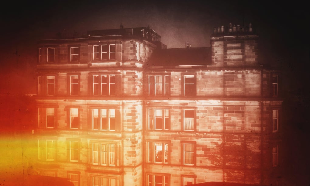 Tenement buildings at night in Edinburgh, Scotland.