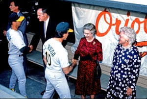 Members of the Oakland Athletics baseball team shake hands with George HW Bush, the Queen and Barbara Bush in Baltimore, Maryland, on 15 May 1991