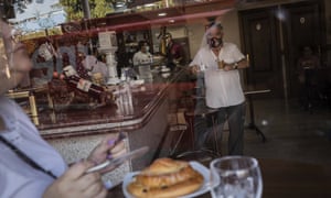 Customers have breakfast inside a bar in the southern neighbourhood of Vallecas in Madrid, Spain, Monday, 21 September, 2020.