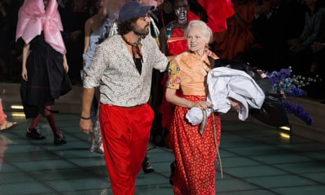 Westwood and Kronthaler walk the runway during the Vivienne Westwood show in Paris on Saturday.