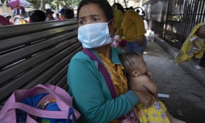 Cambodian children wait for medical care in Phnom Penh. The death toll in China from coronavirus has soared overnight to pass 1,300 cases.