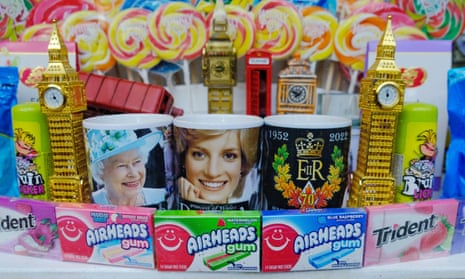 A display of sweets, royal mugs and gold models of Big Ben in the window of a candy store