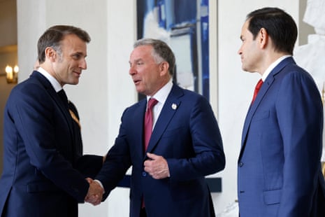 France's president Emmanuel Macron (L) shakes hands with US secretary of state Marco Rubio (R) and US Special Envoy Steve Witkoff before a meeting at the Élysée Palace palace in Paris.