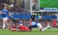 Anthony Taylor looks on as Callum Hudson-Odoi goes down in the box after a challenge from Ashley Young during the Premier League match between Everton and Nottingham Forest at Goodison Park
