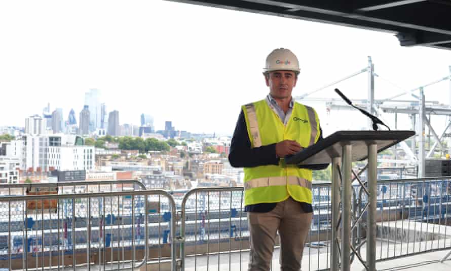 Ronan Harris, the managing director of Google UK and Ireland, speaks, with the City of London towers in the background