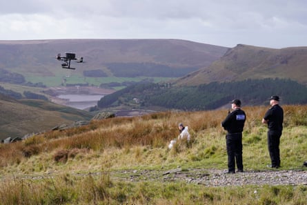 Police motorboat a drone to assistance the hunt connected Saddleworth Moor.
