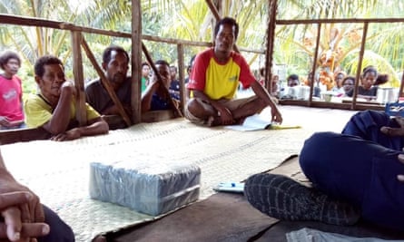 Residents of Budi Budi with part of the cocaine haul