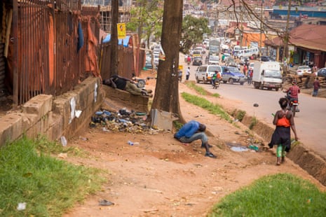 Street children passed out after using drugs in Kisenyi.