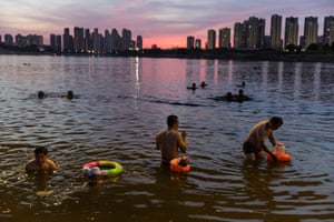 People swim in the Han River in Wuhan, Hubei Province.