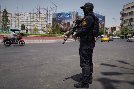 A member of Iran's Revolutionary Guard stands guard at Enqelab-e-Eslami (Islamic Revolution) square in downtown Tehran, Iran, Tuesday, June 24, 2025.