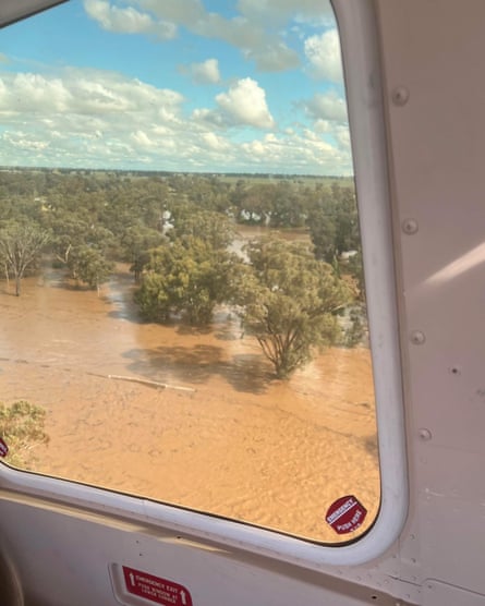 The view from the helicopter flying over flood waters.