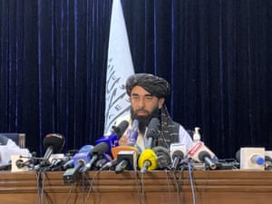 Taliban spokesman Zabihullah Mujahid speaks at at his first news conference in Kabul.