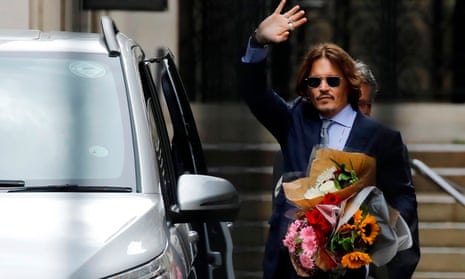 Actor Johnny Depp leaves the High Court in London on 24 July after a hearing in his libel trial against News Group Newspapers.