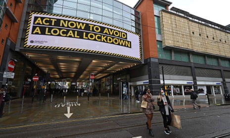 A sign at the Arndale Centre in Manchester warns the public of a local lockdown.