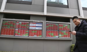 An electronic stock board of a securities firm in Tokyo today