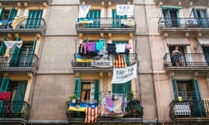 Apartments in Barceloneta display banners protesting against tourist flats.