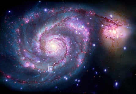 A combination image of M51 in X-rays from Chandra (purple and blue) and optical light from NASA’s Hubble Space Telescope (red, green, and blue). A box marks the location of the possible planet candidate, an X-ray binary known as M51-ULS-1. NB Image has been rotated 90 degrees clockwise.
