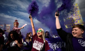 Demonstrators let off flares during a march in Dublin for more liberal Irish abortion laws