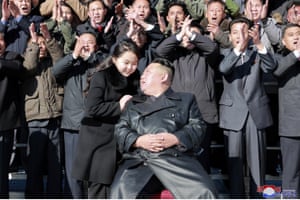 The North Korean leader, Kim Jong-un (front), with his daughter, pose with scientists and workers after the launch of what Pyongyang says was a Hwasong-17 intercontinental ballistic missile, at an unidentified location in North Korea. Independent journalists were not given access to cover the event depicted in this image distributed by the North Korean government