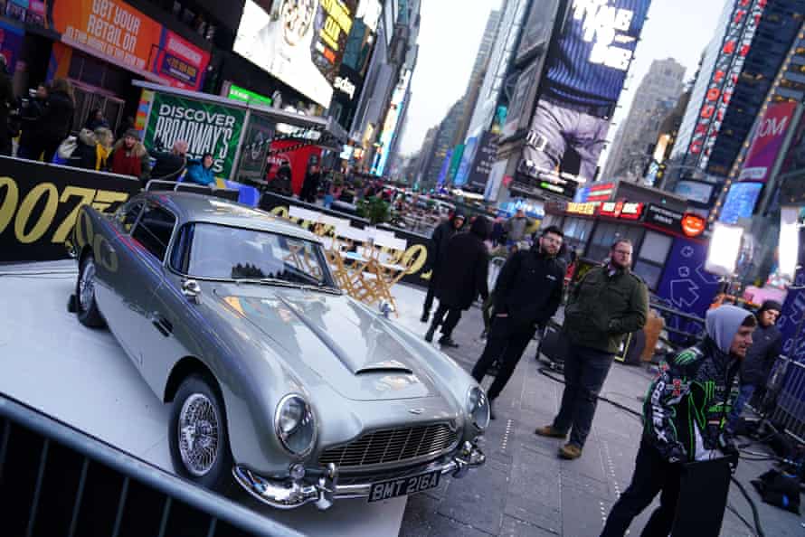 An Aston Martin DB5 is displayed in Times Square, New York, during a promotional tour for No Time to Die.