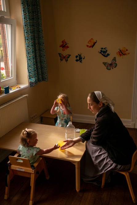Children being looked after by a nanny, Sannerz, Germany