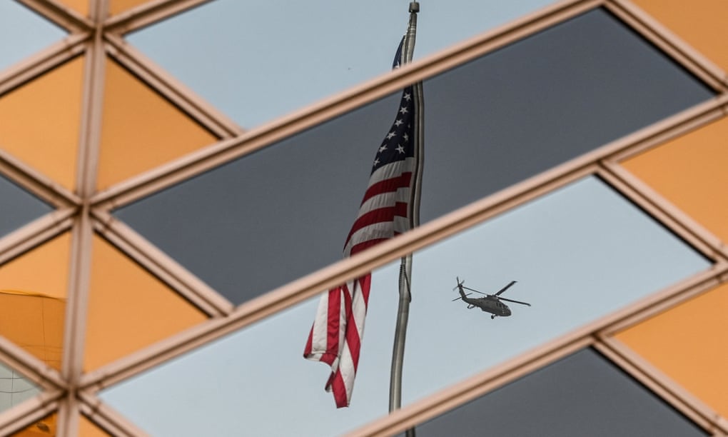 The Stars and Stripes is reflected on the windows of the US embassy building in Kabul.