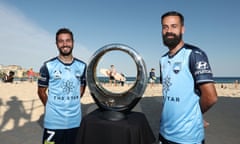 Sydney FC captain Alex Brosque and teammate Michael Zullo pose with the A-League championship trophy