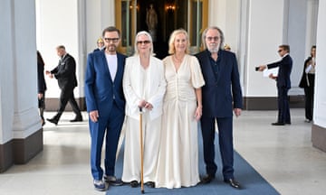 From left: Bjorn Ulvaeus, Anni-Frid Lyngstad, Agnetha Fältskog and Benny Andersson pose for a photo in a large hallway
