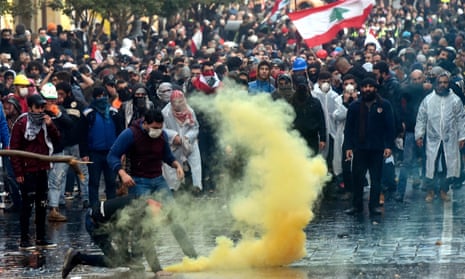 Anti-government protesters clash with riot police outside the Lebanese parliament in central Beirut