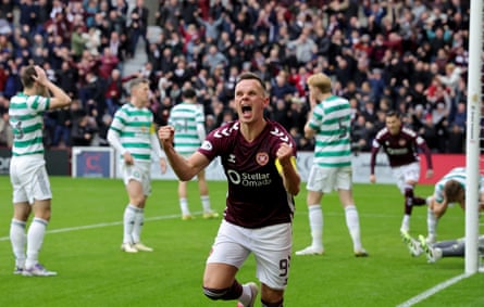 Heearts forward Lawrence Shankland celebrates after his shot was turned in to his own goal by Celtic’s Dane Murray
