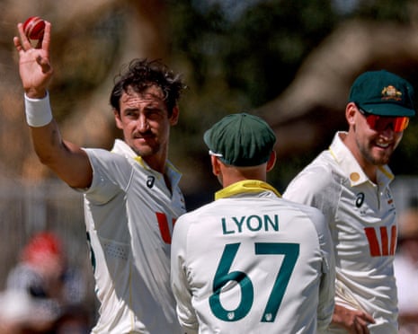 Mitchell Starc celebrates after taking a fifth wicket before lunch on day one of the second Test between Australia and Bangladesh