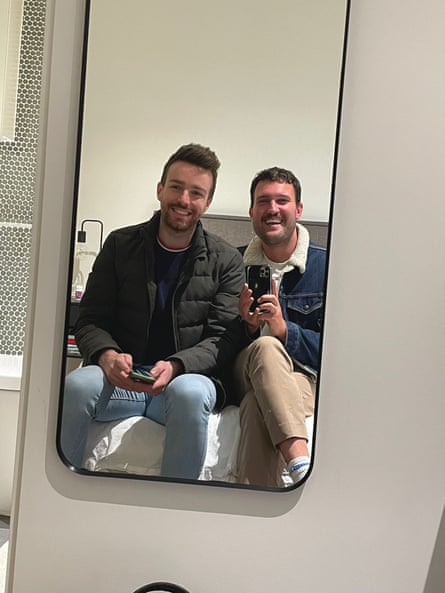Conor Curran and Chris posing in a mirror together