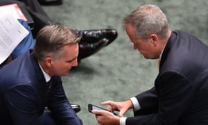 Chris Bowen and Bill Shorten during Question Time. Labor initially said it would implement all the royal commission recommendations.