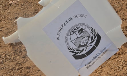 A broken ballot box on the ground outside a polling station in Conakry on the day of Guinea’s constitutional referendum