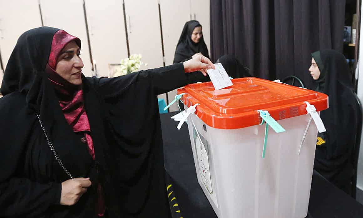 Iranians head out to vote in second round of presidential election.