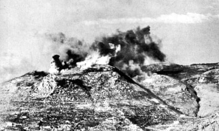 Smoke and fire can been seen from a bombing raid on Monte Cassino in February 1944.