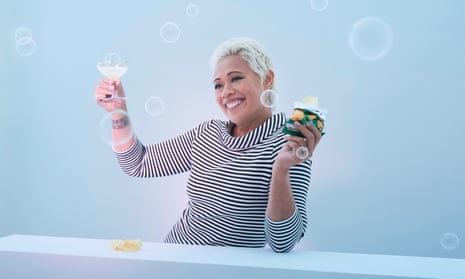 Monica Galetti with a glass of bubbles and a packet of crisps