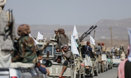 Houthi tribesmen gather in a show defiance against the US-UK strikes