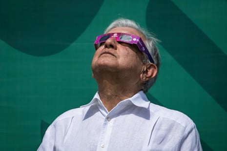 Mexico’s president, Andrés Manuel López Obrador, wears special sunglasses as he observes a solar eclipse moments before totality, in Mazatlán, Sinaloa state, Mexico.