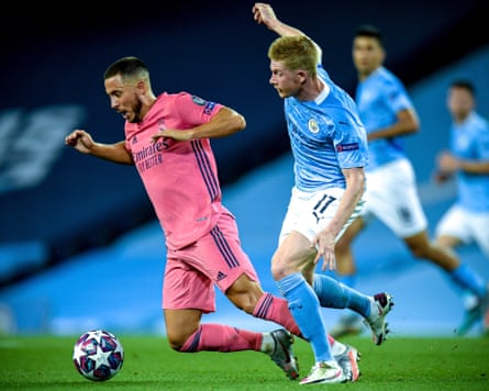 Real Madrid’s Eden Hazard (left) is felled by Manchester City’s Kevin De Bruyne in the Champions League