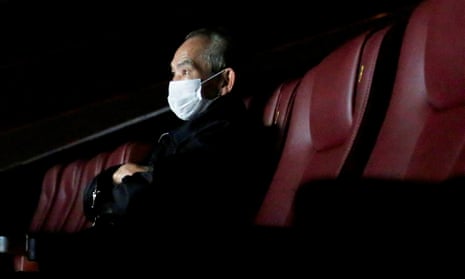 A man wears a protective mask as he watches a movie in Hong Kong on 10 February. 
