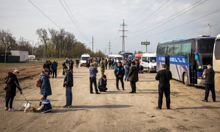 People wait to be allowed to try to return to Berdyansk