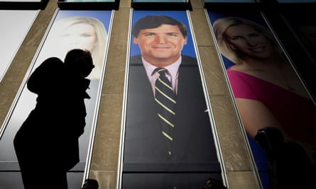 An image of Tucker Carlson is seen on the News Corporation building in New York City.
