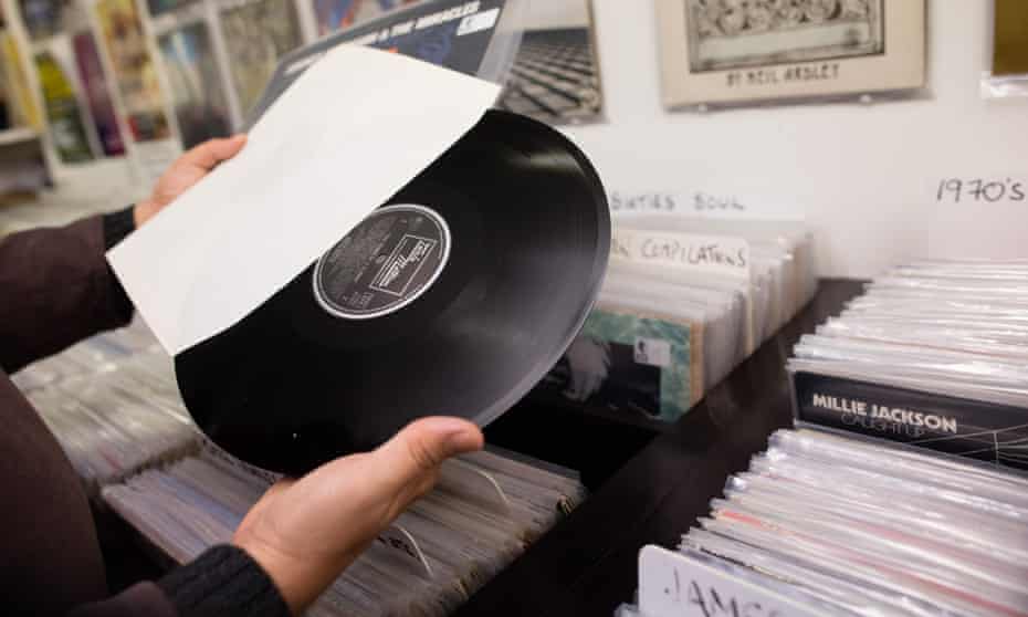 A man browses records for sale in Bristol. Supermarkets such as Sainsbury’s and Tesco now also stock records.