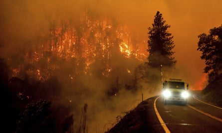 A firetruck drives along California Highway 96 as the McKinney fire burns in Klamath national forest, California.