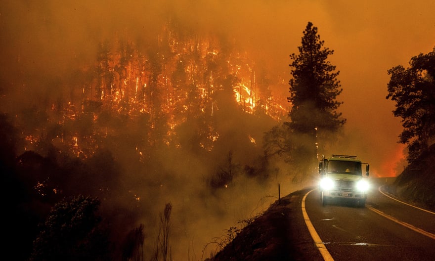 A firetruck drives along California Highway 96 as the McKinney fire burns in Klamath national forest, California.