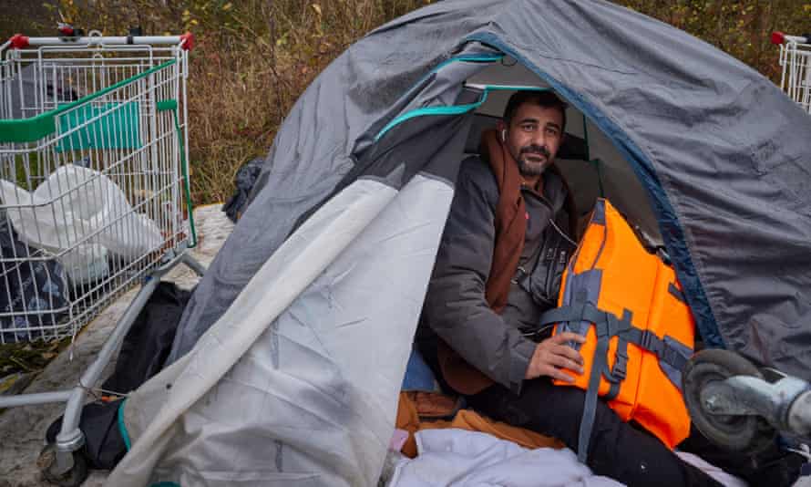 Karwan Tahir, 42, from Kurdish Iraq, holds a life jacket he intends to use when he gets the opportunity to make the crossing across the Channel to the UK.