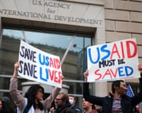 people holding signs